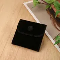 Close-up of a premium small black velvet pouch with secure snap button closure for jewelry - Velvet Snap Bag / 7*7cm / Black