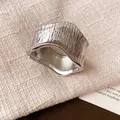 Close-up of minimalist silver wrinkled metal wide ring with textured organic finish - 2# Bangle Silver Matte Wrinkled