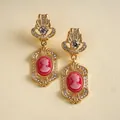 Detailed view of vintage court style earrings with red resin cameo portrait and rhinestones - Portrait Relief / 1 Pair Pack / Gold-Pink
