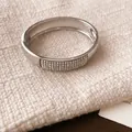 Detail of silver-toned bangle featuring five rows of shimmering crystals on fabric - 1# Bangle Silver Rhinestone