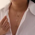 Close-up of a gold stainless steel heart lariat necklace with sparkling rhinestones - Triple Heart Double Layer Tassel Style (3#) / Gold