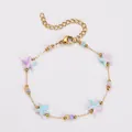 Zierliches Edelstahl-Armband mit pastellfarbenen Seestern-Anhängern und Goldperlen - Armband / Hellblau-Rosa