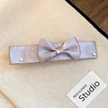 Detail view of an elegant champagne satin bow hair clip adorned with sparkling rhinestones - Bowknot Duckbill Clip / Lavender