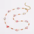 Bunte Seestern-Perlenkette aus Edelstahl mit Ozean-Thema im Gold-Finish-Design. - Halskette / Orange-Rosa Gemischt