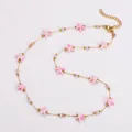 Edelstahl Halskette in Gold mit rosa Seestern-Anhängern und Perlen Meeres-Serie - Halskette / Rosa Weiß