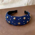 Close-up of vintage blue velvet wide headband with golden star-shaped studs - Headband / Blue