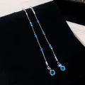 Close-up of elegant blue crystal tassel earrings showing the sparkling multifaceted beads - Water Drop Tassel Style (HE35674) / Silver / Silver-Blue