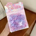 Macro detail view of colorful disposable children's hair rubber bands in cute packaging - 400 Pieces/Pack / Purple-Pink