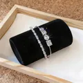 Detailansicht funkelnder Silberarmbänder mit Zirkoniasteinen in verschiedenen Formen - Silberner Zirkonia Armreif Armband Zweiteiliges Set (3) / Silber