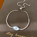 Detailweergave van de Evil Eye-armband met witte schelp en zirkonia-stenen - Blauwe Boze Oog Stijl (2#)
