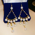 Détail de boucles d'oreilles pendantes dorées élégantes avec glands en perles blanches - Pearl Pendant Tassel Style (2# Ear Hook) / Style Crochet / Or-Blanc
