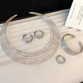 Detailed view of silver-tone multi-strand jewelry set with choker, bracelet, and earrings - Choker Bracelet Earrings Ring / Silver