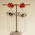 Detailed view of vintage resin rose earrings with translucent glass flower tassels - Blooming Flower Tassel Style / Red Black Transparent