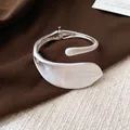 Close-up of silver-tone leaf design cuff bracelet with matte and glossy finish - Matte Style (2#)