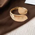 Detail shot of a vintage gold geometric leaf cuff bracelet with a textured matte finish. - Matte Style (3#)
