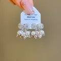 Elegante zilveren strik oorbellen in Franse stijl met witte en roze hangende parels. - Holle Vlinder Kunstparel Kwast Stijl (42#)