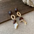 Detailed macro view of New Chinese vintage earrings featuring wood beads and shell dangles - 7# Silver Pin - Brown