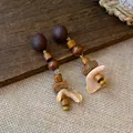 Macro view of vintage earrings with wooden beads and natural shell petals on wood. - 6# Silver Pin-Coffee