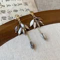 Close-up view of elegant vintage shell petal drop earrings with hammered gold studs - 1# Silver Post - Gold - Coffee