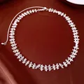Detailed view of clear crystal beads on a delicate silver-colored choker necklace. - Necklace / Silver-White
