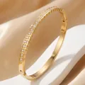 Elegant 18K gold plated stainless steel bangle with square set cubic zirconia crystals - Irregular Rhinestone Bangle / 18K Gold Plated