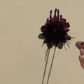 Gothic Halloween hair clip with dark flowers, skeleton hand, and long chain tassels. - Skeleton Hand Flower Tassel Clip / Single Piece / Black Red