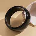 Detailed view of a minimalist glossy black round bangle showcasing its smooth surface - Glossy Round Style (37# Bangle)