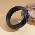 Close-up of a marbled dark blue geometric faceted resin bangle with wave patterns. - Geometric Faceted Style (41#)
