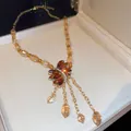 Elegant amber-colored faceted beaded necklace with leaf-shaped pendant in a gift box - Necklace-Gold-Brown