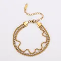 Macro detail of 18K gold plated three-strand bracelet with twisted rope and white zircons. - 18+6cm / Gold