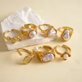 Close-up of 7pcs vintage gold rings set featuring irregular pearls and floral designs. - 7-piece Set / Gold