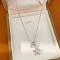 Detailansicht einer 18k vergoldeten Halskette mit funkelnden Zirkonia-Sternanhängern - Halskette (18k Vergoldet) / Silber