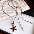Collier vintage en cordon de cuir marron avec pendentif étoile de mer à motif léopard - Étoile / Marron