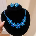 Close-up of sparkling blue zircon flower necklace and earrings jewelry set for women - Earrings Necklace Set / Blue