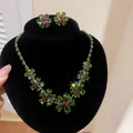 Detailed shot of sparkling green zircon floral jewelry set on black velvet stand - Earrings Necklace Set / Green