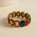 Detailed view of a retro geometric elastic bracelet with colorful rectangular faux gemstones - Gold-Multicolor