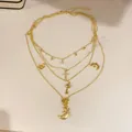 Collier doré multi-rangs style bohème vintage avec breloques lune et clé élégantes - Or