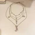 Collier multi-rangs bohème argenté avec pendentifs lune et clé - Argent