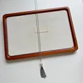Detailed view of elegant stainless steel tassel necklace with a white shell bead - Silver-White