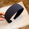 Close-up of a padded black and white polka dot headband on a linen background - Thickened High Top Wide Style / Black
