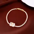 Macro view of 18k gold plated bracelet with square zirconia and butterfly detail - Butterfly Square / Gold-White