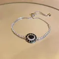 Elegante zilverkleurige armband met ovale zirkoon hanger en verstelbare schuifsluiting - Zilver Zwart