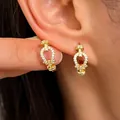 Elegant gold-plated horseshoe hoop earrings with brilliant white zirconia pavé stones - Horseshoe Pave Zirconia Hoop (X637)