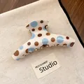 Close-up of vintage polka dot hair claw clip with blue and brown patterns on canvas bag - Long Arc Style (Type 1) / Blue Coffee Polka Dot