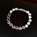Detail showing multi-colored heart-shaped zircon bracelet with high-shine finish - Silver - Rainbow