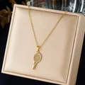 Detail view of a gold-plated tennis racket pendant necklace with sparkling rhinestones - Tennis Racket Pendant (N4583) / Gold