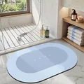Non-slip oval light blue diatomaceous earth bath mat with elegant HOME lettering - 40*60cm / Oval / Light Blue