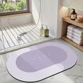 Purple oval diatom mud bath mat with white HOME print and anti-slip backing for bathroom decor - 40*60cm / Oval / Purple