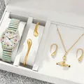 Detailed view of floral women's quartz watch paired with a gold teardrop jewelry set - Mint Green Floral