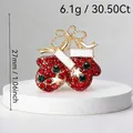 Sparkling Christmas mitten brooch with red and green rhinestones in gold finish. - Glove and Boot Style (105)
